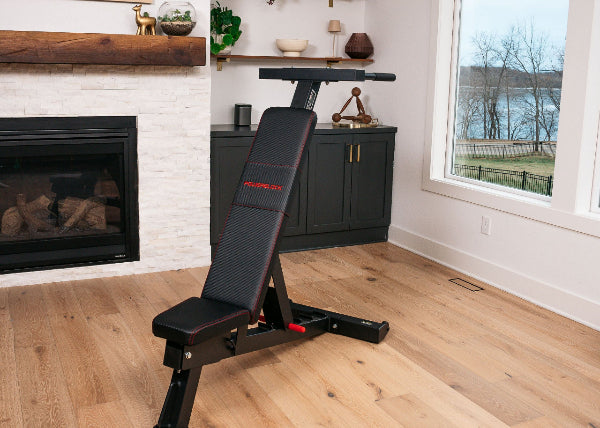PowerBench 2.0 with dip attachment in home gym
