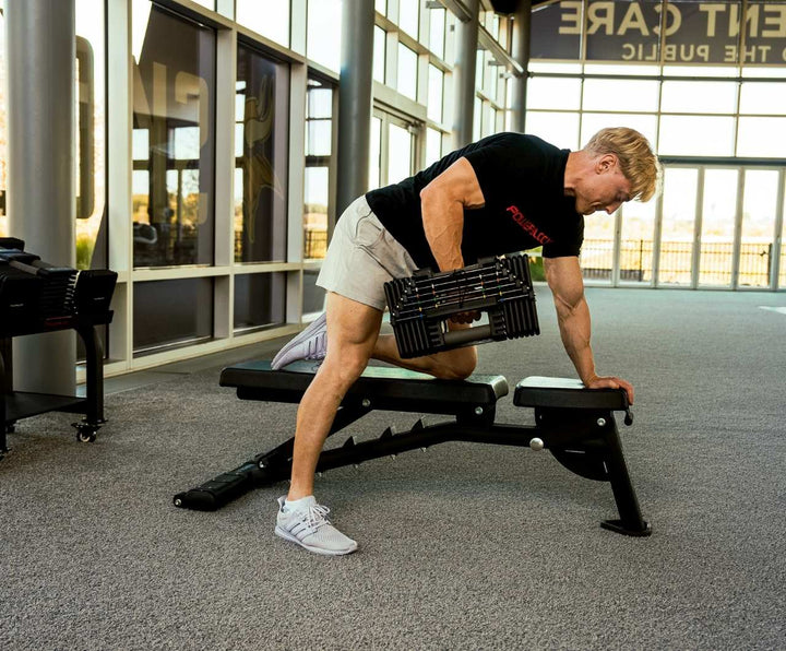 Man Using Commercial pro 125 on PowerBlock Bench
