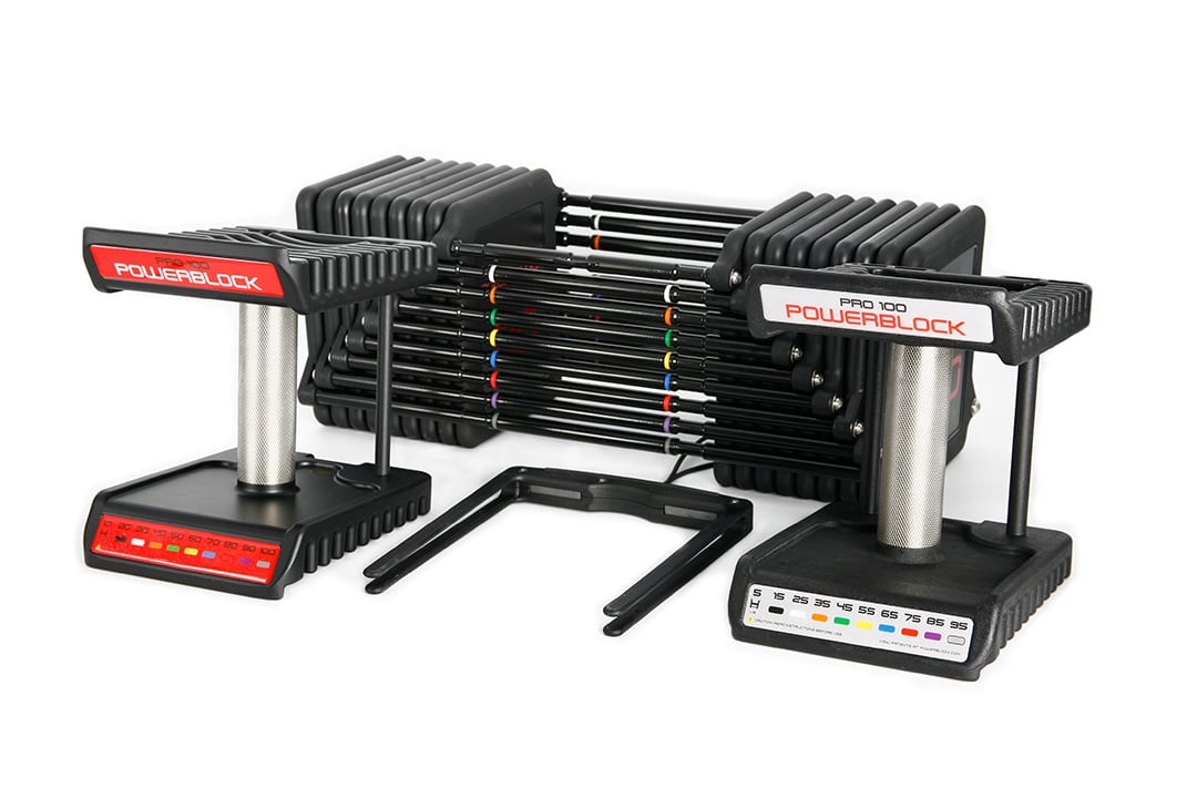 Commercial Pro 100 adjustable dumbbell knurled grip handles, weight plates and magnetic selector pin.