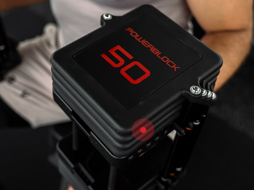 Close-up view of the PowerBlock Commercial Pro 100 50 lb weight plate.