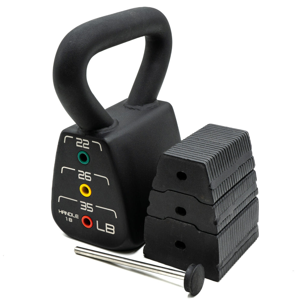 A PowerBlock Pro adjustable kettlebell 18 to 35 pounds sitting next to internal weight stack and selector pin