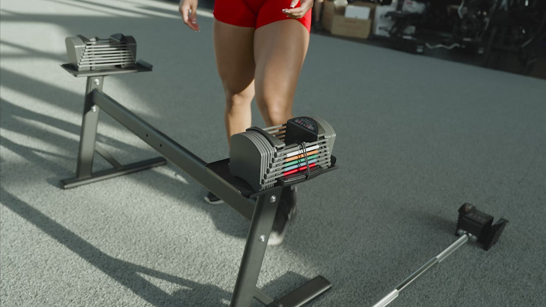 PowerBlock Sport 24 adjustable dumbbells being used as an adjustable barbell with a compatible barbell attachment