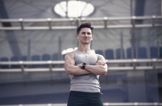 A male athlete looks intently ready to perform a workout