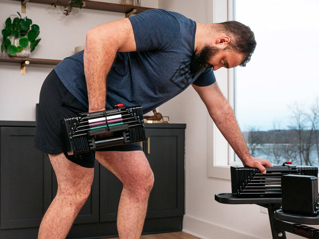 Man performing a bent over dumbbell ro using the PowerBlock Elite USA Adjustable Dumbbell