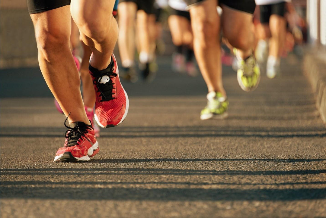 close up of runners shoes in a race