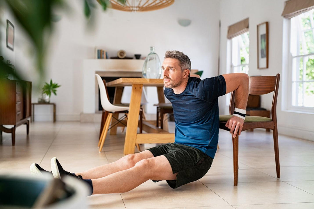 An athlete works out at home in his dining room.