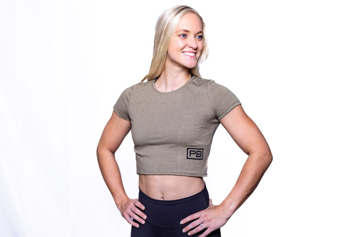 Woman wearing the Olive PowerBlock Womens Crop Tee.