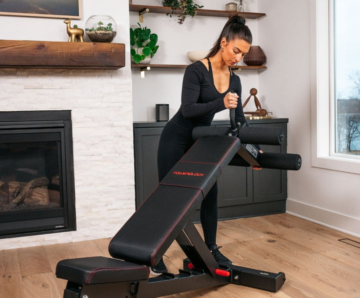 Woman attaching ab attachment to PowerBench 2.0