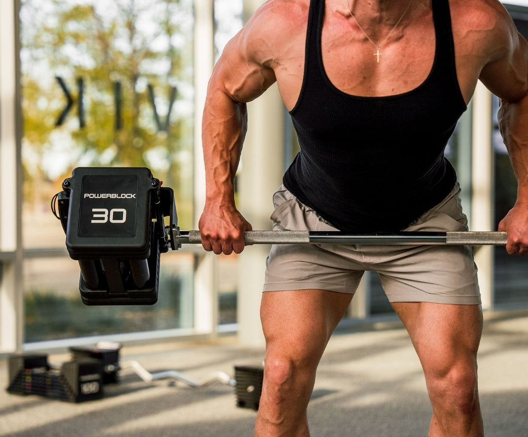Close up of a man curling the Pro 100 Straight Bar