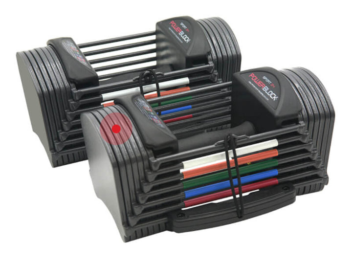 A pair of gray PowerBlock TPR grip Sport 24 adjustable dumbbells, showing the gray powder coat weight plate finish