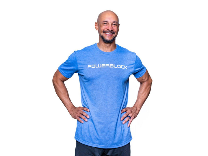 A man wearing an azule-blue men's PowerBlock tee