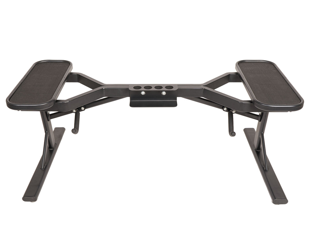 PowerBlock barbell stand in a studio environment without barbells on the stand.