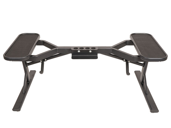 PowerBlock barbell stand in a studio environment without barbells on the stand.