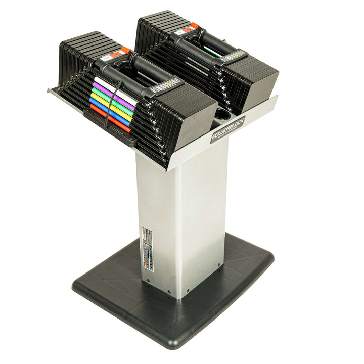 Powerblock large column stand shown standing with adjustable dumbbells on the stand