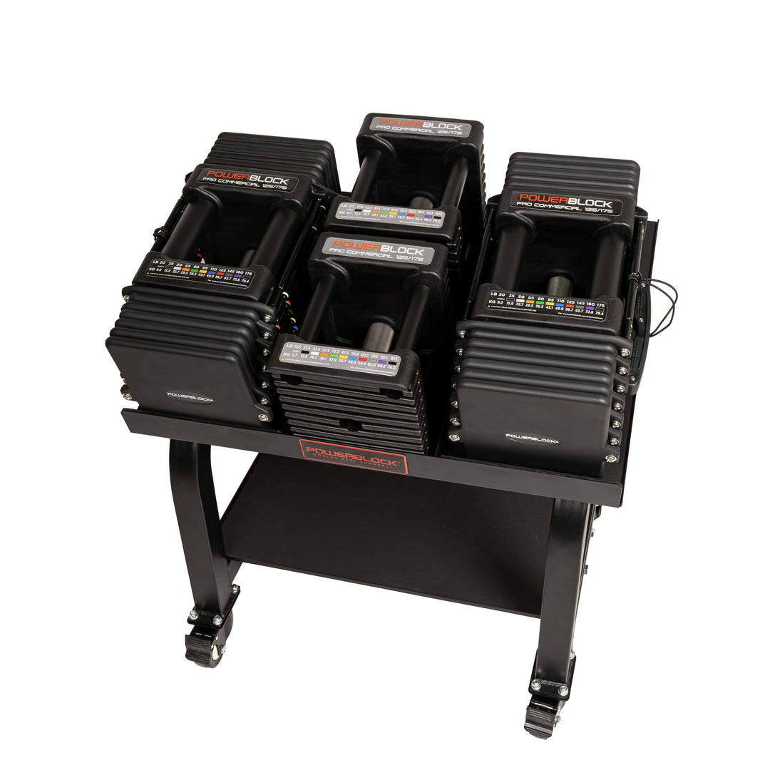 PowerBlock Commercial Pro 125 adjustable dumbbells with knurled grips on a Pro Max stand.  Shown with a pair of 12.5 and 20lb handles.