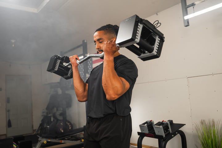 Bicep curl with the PowerBlock Elite USA EZ Curl Bar and Elite USA 90 Adjustable Dumbbells.