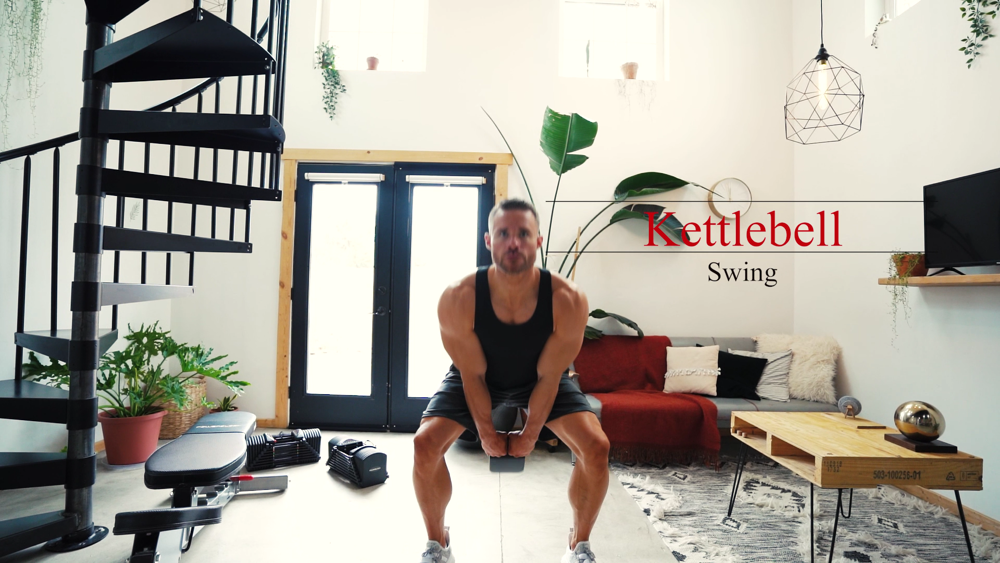 A man doing kettlebell swings with a PowerBlock adjustble kettlebell