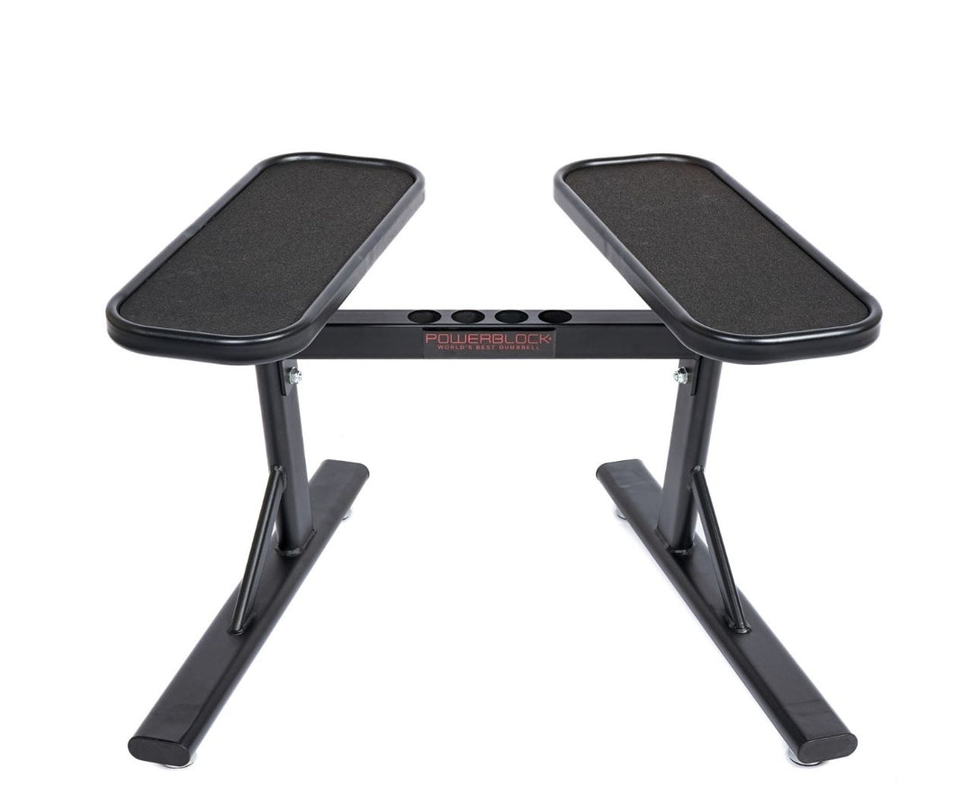 PowerBlock powermax 2.0 adjustable dumbbell stand showing micro weight storage in a studio background