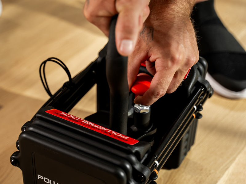 Man installing the Kettlebell Handle onto a PowerBlock Pro 100 EXP.