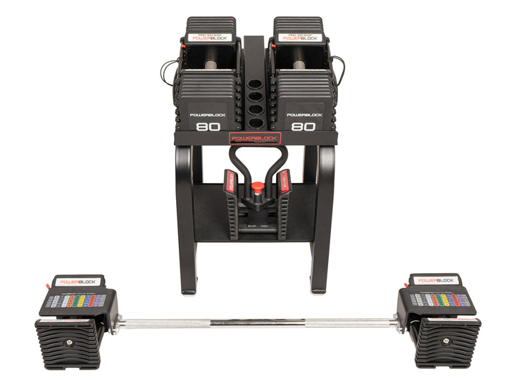 PowerBlock Pro 100 stage 3 adjustable dumbbell bundle. Includes pair of 5 to 80 lb dumbbells, a kettlebell handle, and straight bar.