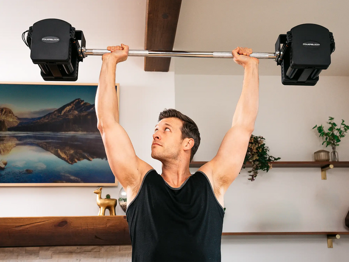 Overhead press using the PowerBlock Pro Series Straight Bar as an adjustable barbell
