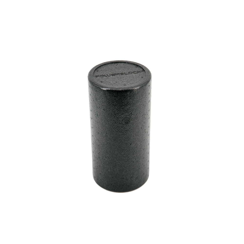 Foam roller standing vertically with PowerBlock logo shown in foam.