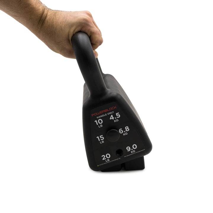 A hand holding a black Sport Kettlebell inocrrectly at an angle while pulling it off the weight stack. 