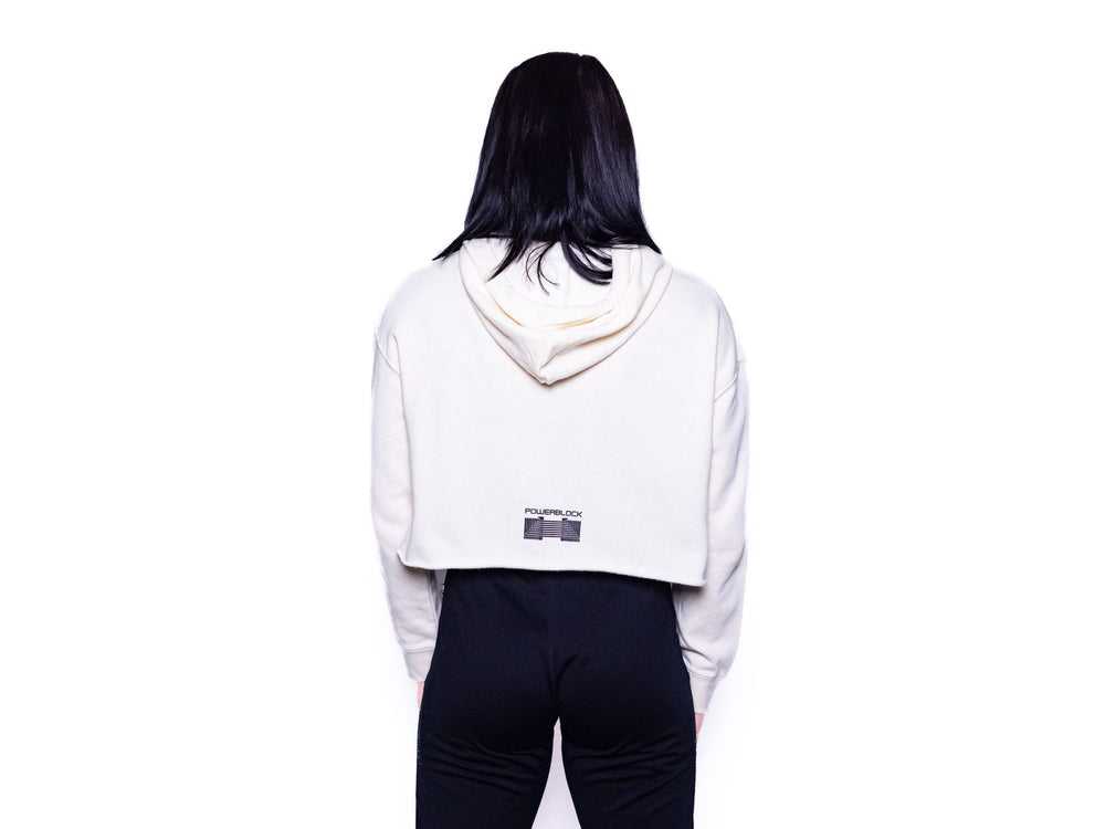 The backside of the Bone colored Womens Crop Hoodie featuring the PowerBlock logo.