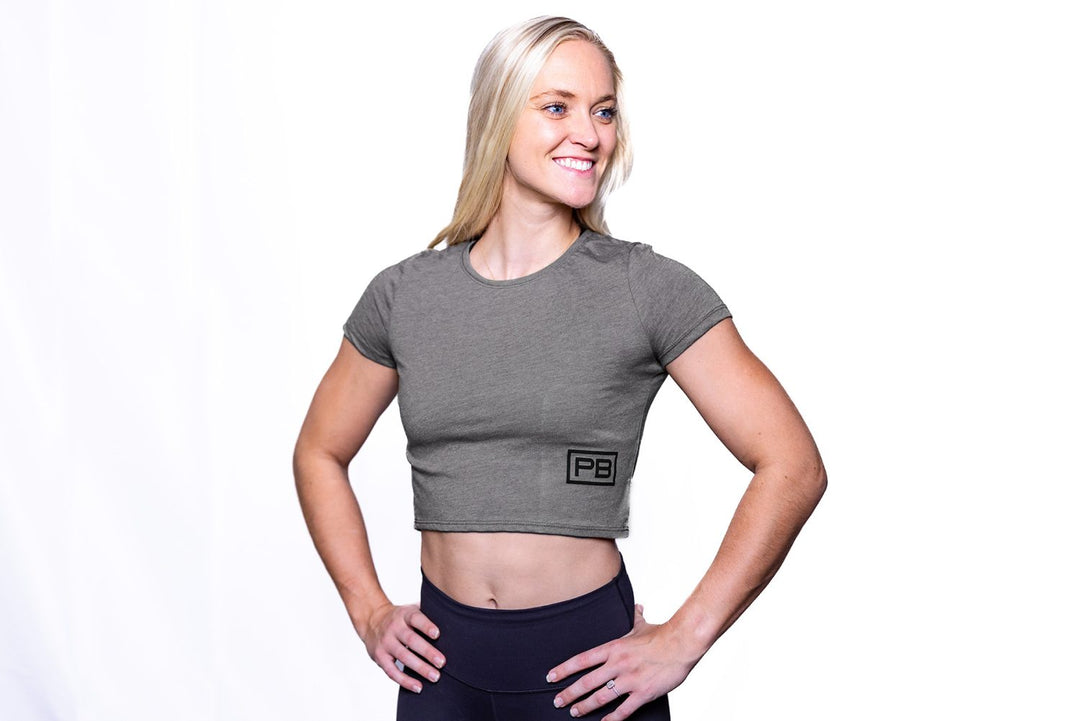 Woman wearing the Dark Grey PowerBlock Womens Crop Tee.