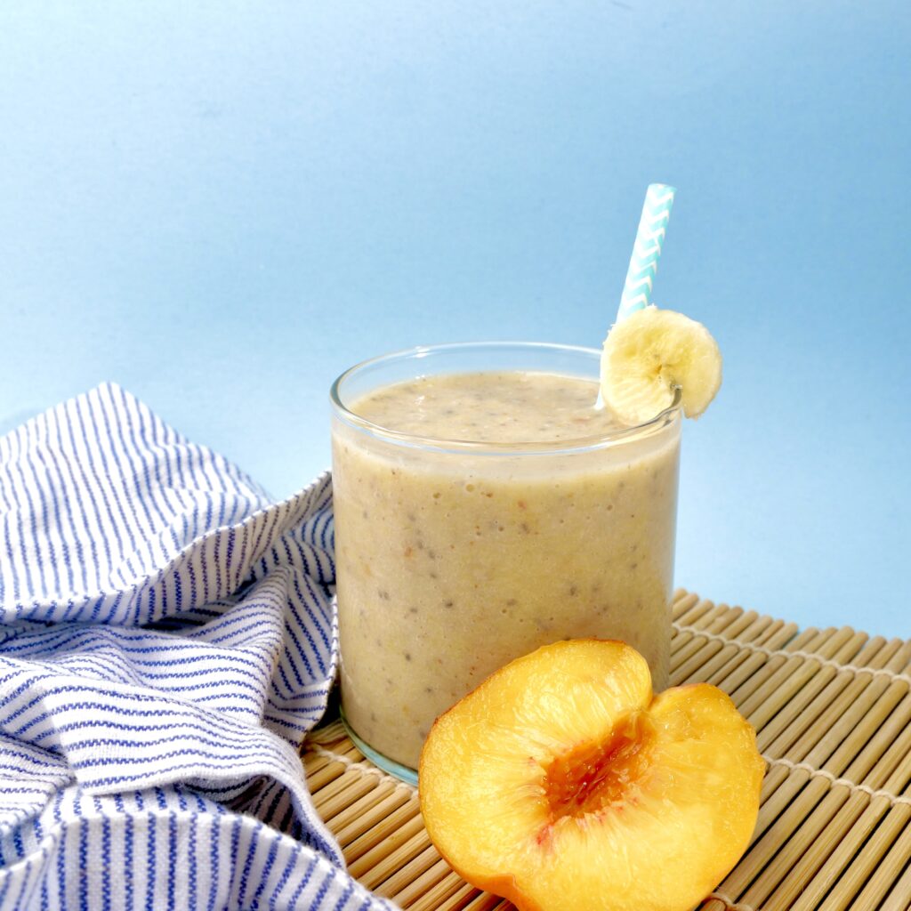 A Peach Banana Protein Smoothie, a nutritious drink that's tasty and easy to make.